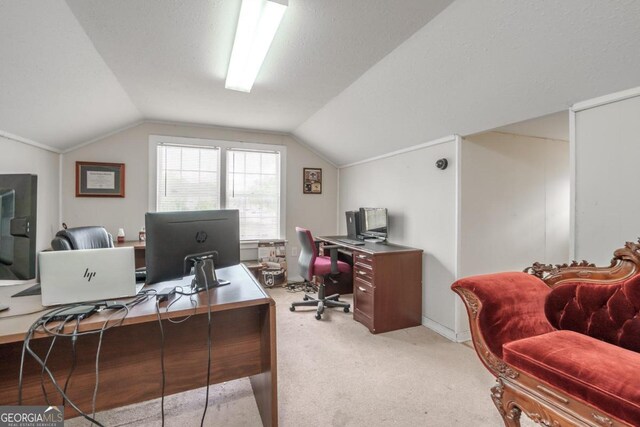 home office featuring vaulted ceiling, carpet floors, and a textured ceiling