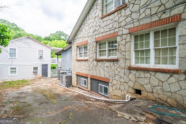 view of side of property with cooling unit