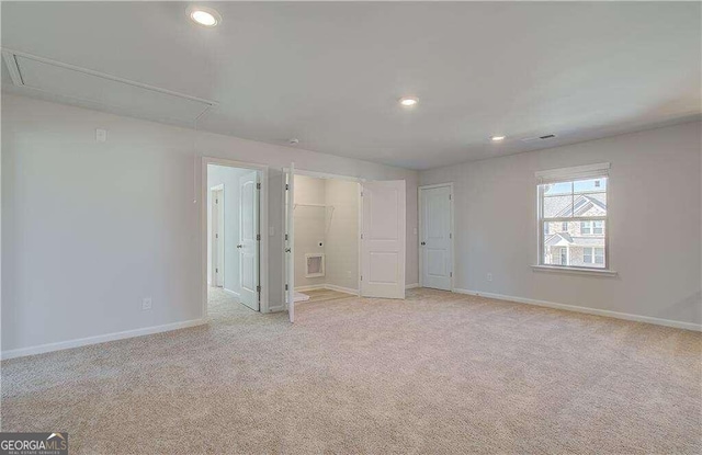 unfurnished bedroom with light carpet