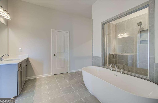 bathroom with vanity, plus walk in shower, and tile patterned flooring