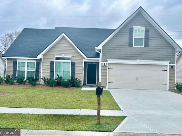 view of front facade with a garage and a front lawn