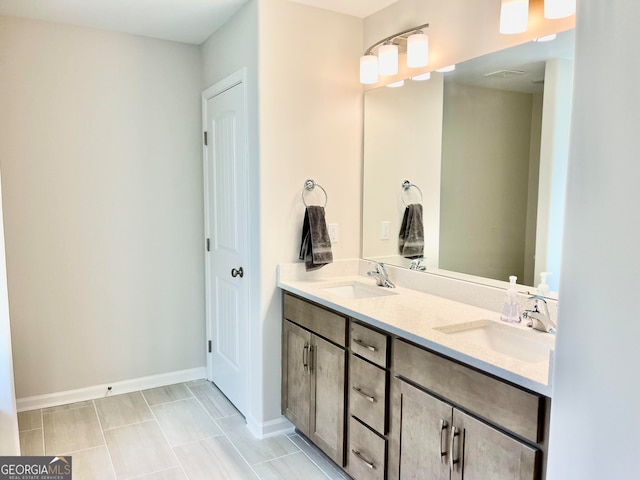 bathroom with tile patterned flooring and vanity