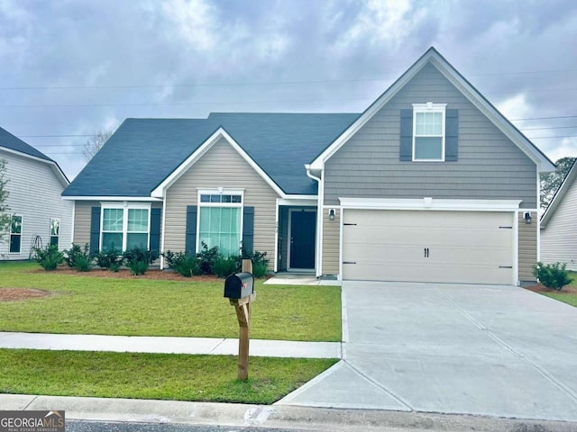 view of front facade with a garage and a front lawn