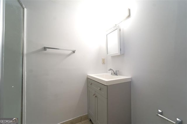 bathroom with vanity and tile patterned flooring