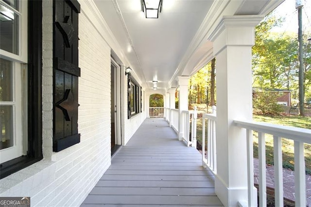 wooden terrace featuring a porch