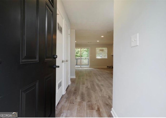 hall with light hardwood / wood-style flooring