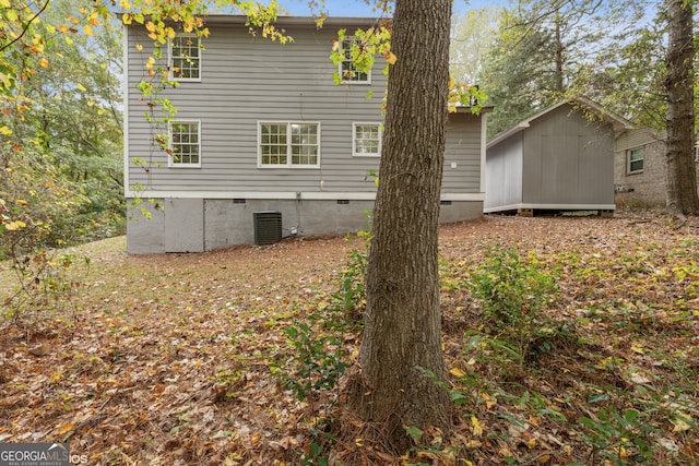 view of side of home featuring a storage unit and cooling unit