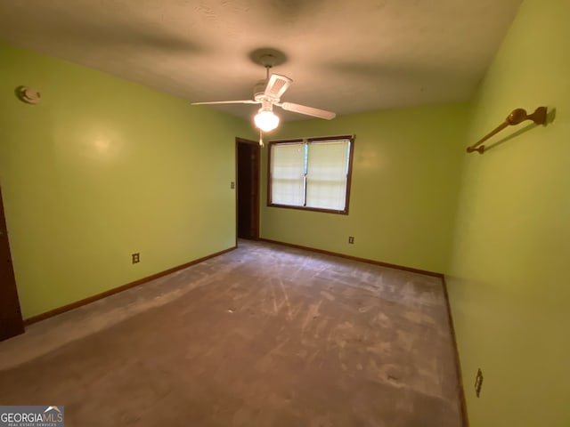 carpeted empty room with ceiling fan