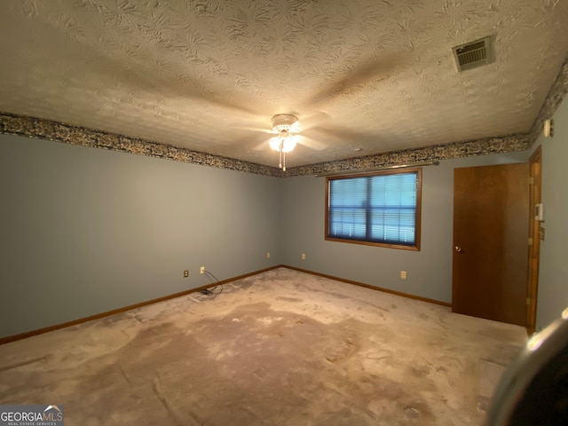 unfurnished bedroom featuring carpet flooring, a textured ceiling, and ceiling fan