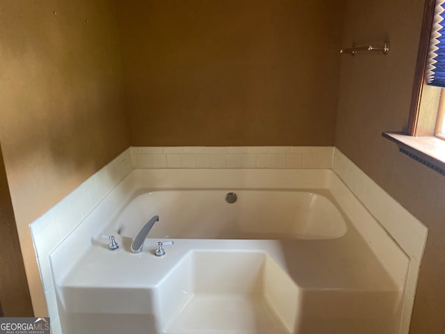 bathroom with a tub