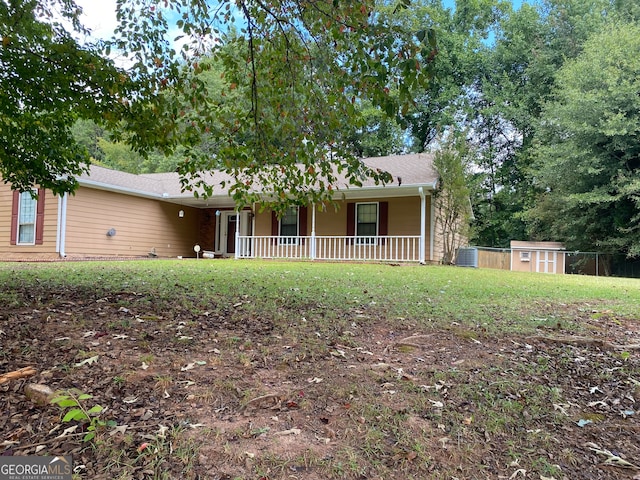 ranch-style house featuring a storage shed and central AC unit