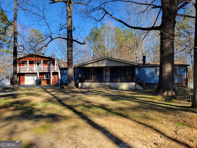 view of front facade with a front yard and a garage