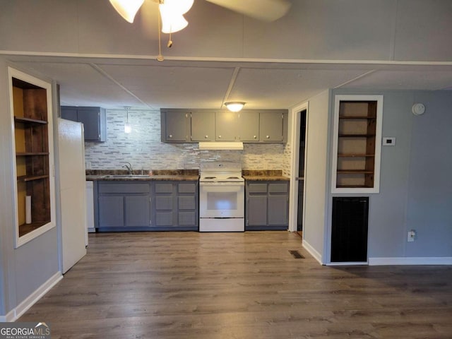 kitchen featuring hardwood / wood-style floors, white electric range oven, gray cabinetry, and backsplash