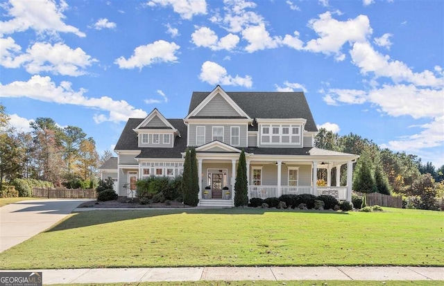 view of front of property featuring covered porch and a front lawn