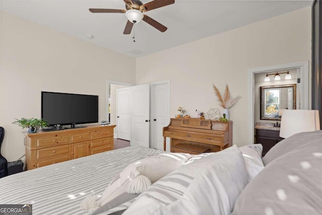 bedroom with ceiling fan and ensuite bathroom