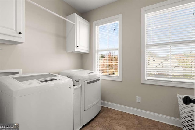 laundry area featuring cabinets and independent washer and dryer