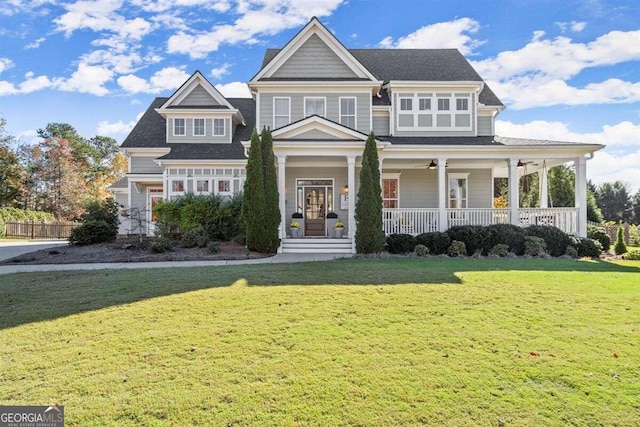 view of front of property with a front yard and covered porch