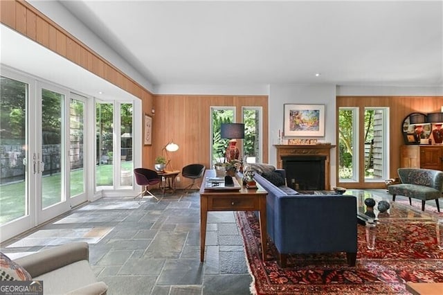 living room with wood walls