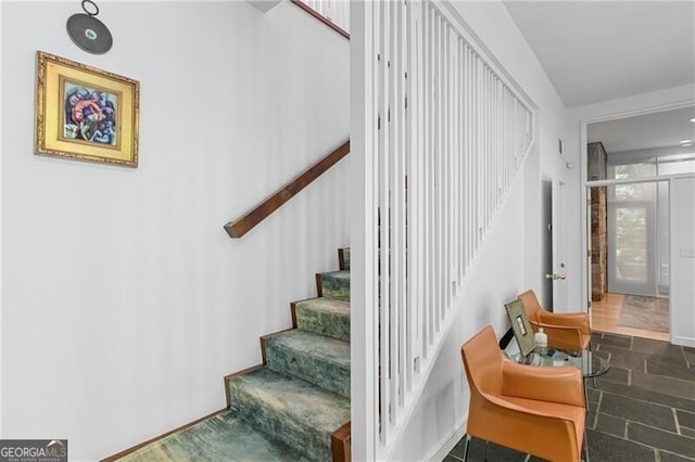 stairs with french doors