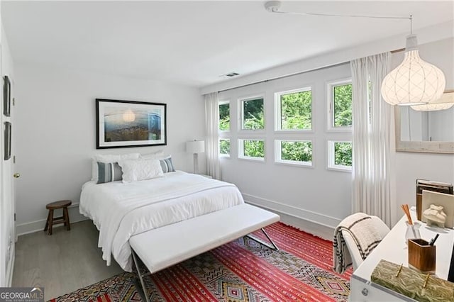 bedroom with hardwood / wood-style floors