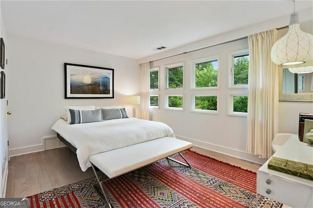 bedroom with hardwood / wood-style floors