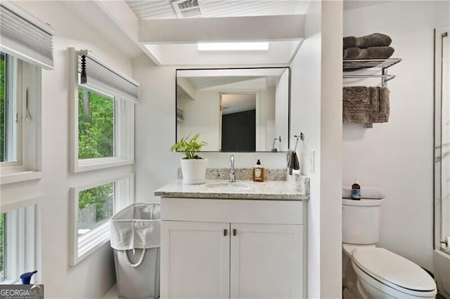 bathroom featuring vanity and toilet