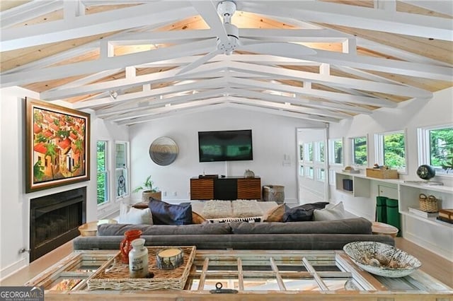 sunroom / solarium with lofted ceiling with beams