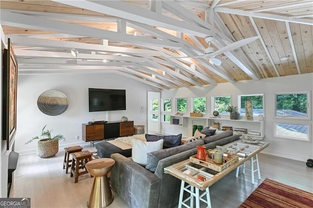 sunroom with lofted ceiling with beams and ceiling fan