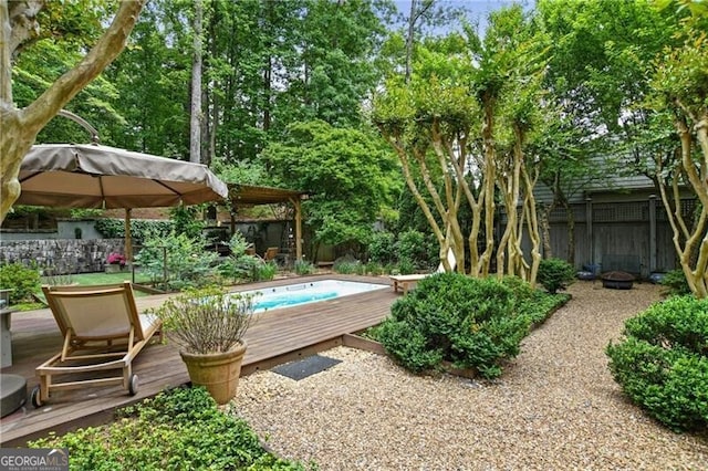 view of swimming pool with a deck