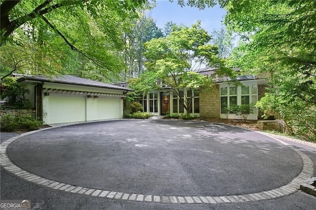 ranch-style home with a garage