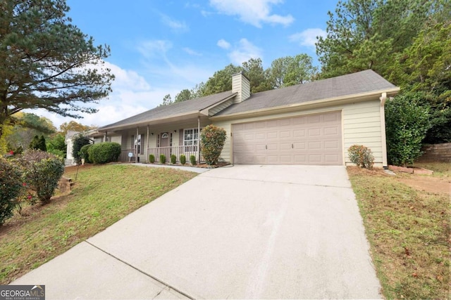 ranch-style home with a front yard, a porch, and a garage