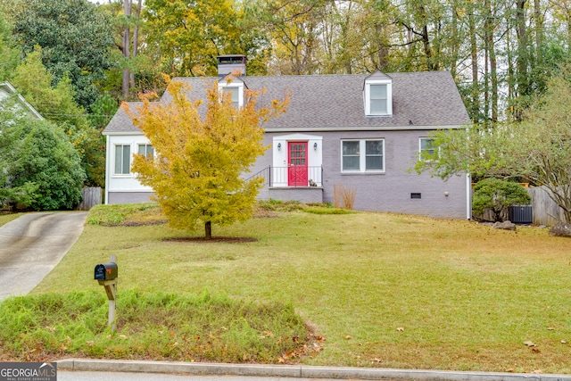 cape cod house featuring central AC and a front yard