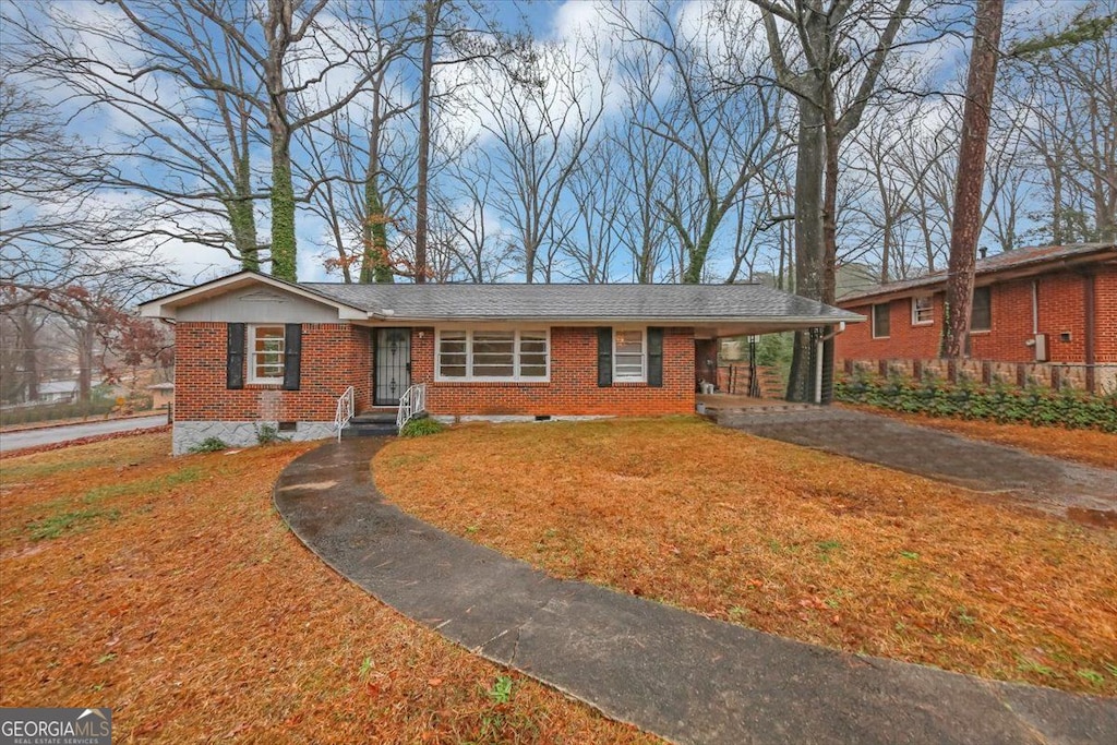 ranch-style home with a carport