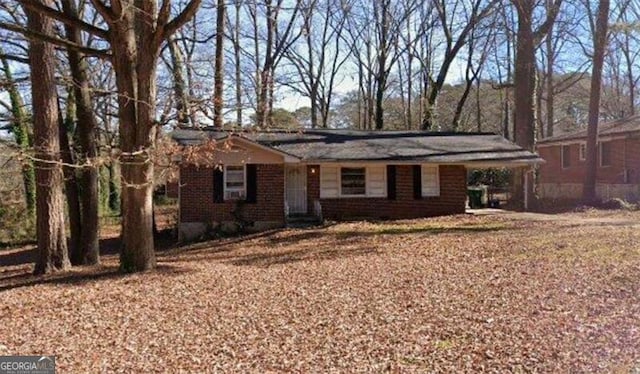 single story home with a carport