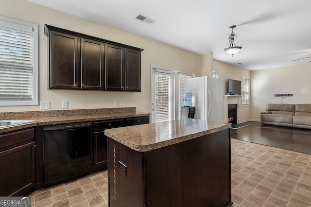 kitchen featuring pendant lighting, a kitchen island, black dishwasher, dark brown cabinets, and white fridge