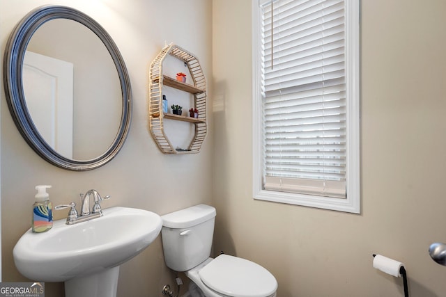 bathroom with sink and toilet