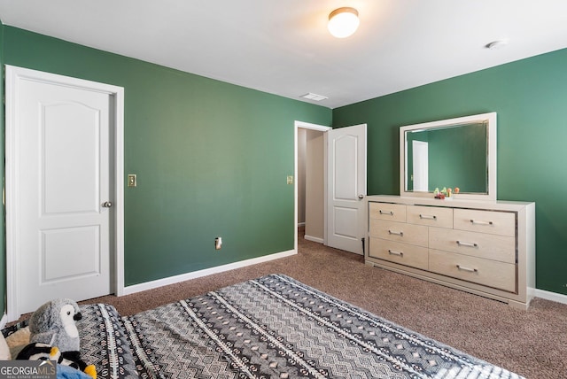 bedroom with dark colored carpet