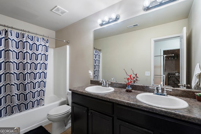 full bathroom with shower / bath combo with shower curtain, vanity, and toilet