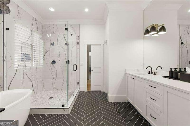 bathroom with vanity, crown molding, and independent shower and bath