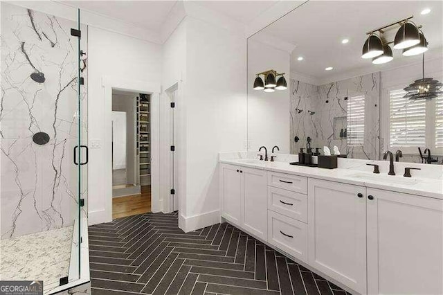 bathroom with vanity and a shower with shower door