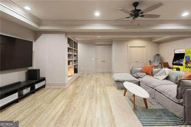 living room with ceiling fan and light hardwood / wood-style floors