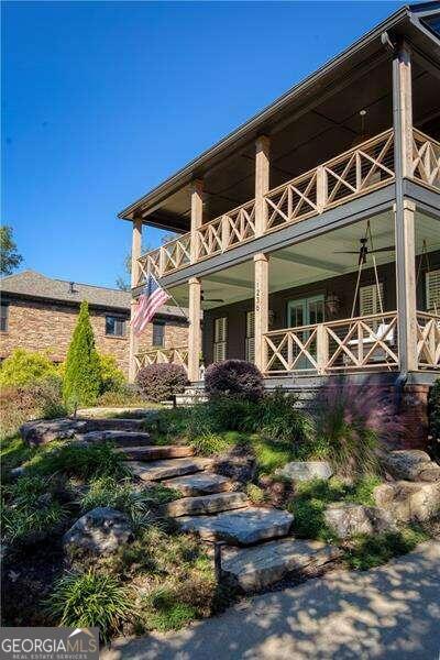 back of house featuring a balcony