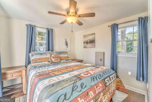 bedroom featuring ceiling fan and hardwood / wood-style flooring