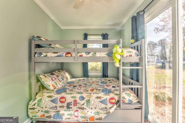 bedroom featuring ceiling fan and ornamental molding