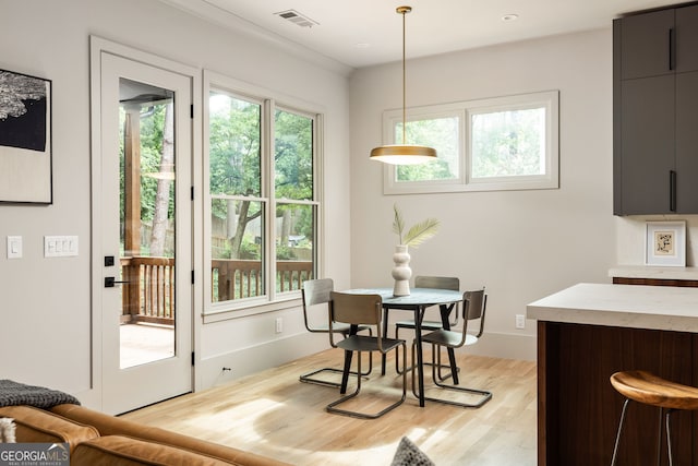 dining area featuring light wood-type flooring