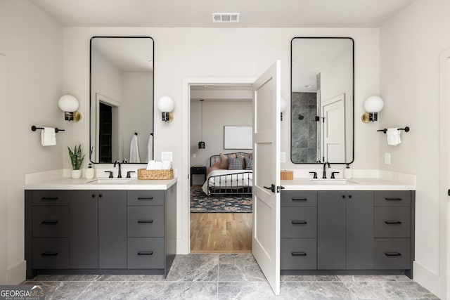 bathroom with hardwood / wood-style floors and vanity