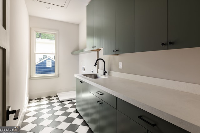 kitchen featuring gray cabinets and sink