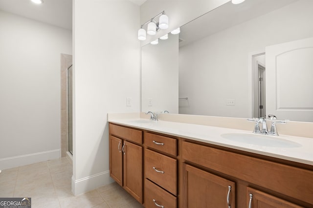 bathroom with vanity, walk in shower, and tile patterned floors