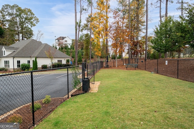 view of yard featuring tennis court