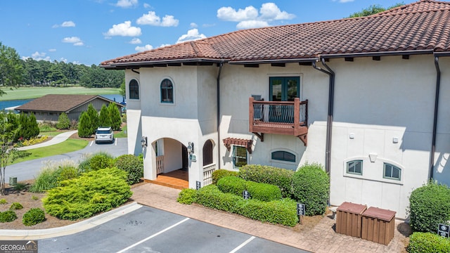 view of front of property with a balcony